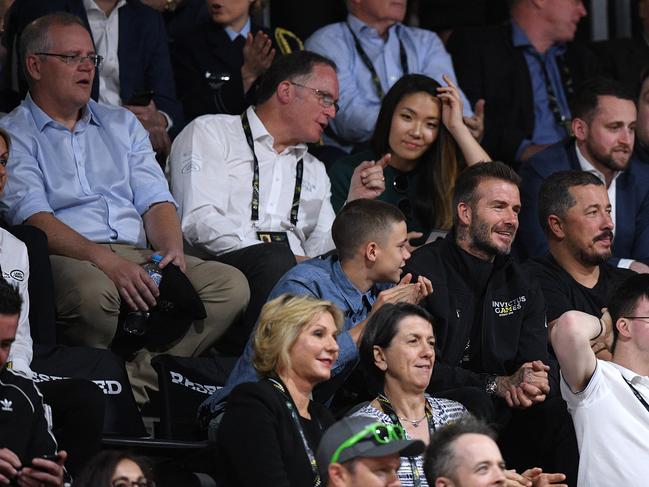 David Beckham (centre) and son Romeo (left of centre) are seen in the crowd, along with Australian Prime Minister Scott Morrison (top left) during the Wheelchair Basketball Final at the Invictus Games in Sydney, Australia. Picture: AAP