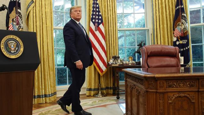 Donald Trump next to ‘the Resolute desk’ in the Oval Office of the White House in Washington. Picture: Getty Images