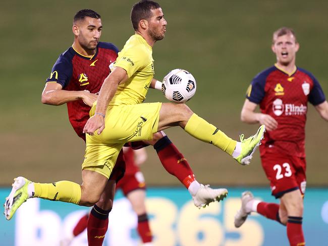 WOLLONGONG, AUSTRALIA - APRIL 25: Tomer Hemed of the Phoenix jumps for the ball during the A-League match between the Wellington Phoenix and Adelaide United at WIN Stadium, on April 25, 2021, in Wollongong, Australia. (Photo by Mark Kolbe/Getty Images)