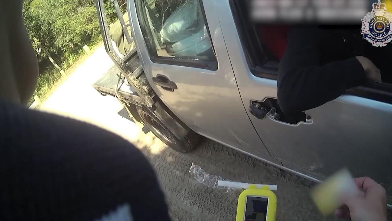 A driver showing police his car door that doesn’t have a handle on the exterior during Operation Sandstorm. Picture: QPS