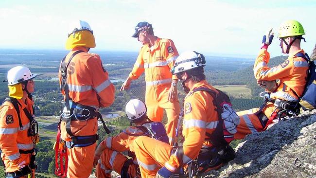 Lou Spann instructs new vertical rescue recruits during training on Mt Tibrogargan. Picture: Contributed