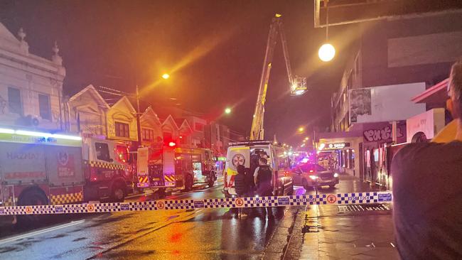 Emergency services attended an apartment fire on Enmore Rd, Newtown on Thursday night, which police declared a crime scene. Picture: Paul Brescia