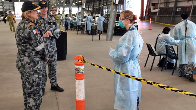 Surgeon General of the Australian Defence Force,Rear Admiral Sarah Sharkey defence personnel manning a coronavirus testing station. Picture: AFP