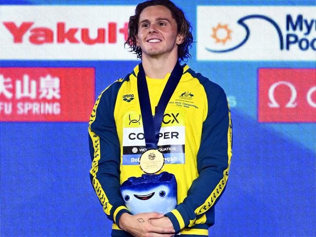 DOHA, QATAR – FEBRUARY 18: Gold Medalist, Isaac Cooper of Team Australia poses with his medal during the Medal Ceremony after the Men's 50m Backstroke Final on day seventeen of the Doha 2024 World Aquatics Championships at Aspire Dome on February 18, 2024 in Doha, Qatar. (Photo by Quinn Rooney/Getty Images)
