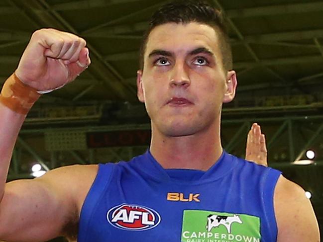 MELBOURNE, AUSTRALIA - JULY 24: Tom Rockliff of the Lions celebrates as he leaves the ground after winning the round 18 AFL match between the Essendon Bombers and the Brisbane Lions at Etihad Stadium on July 24, 2016 in Melbourne, Australia. (Photo by Scott Barbour/Getty Images)