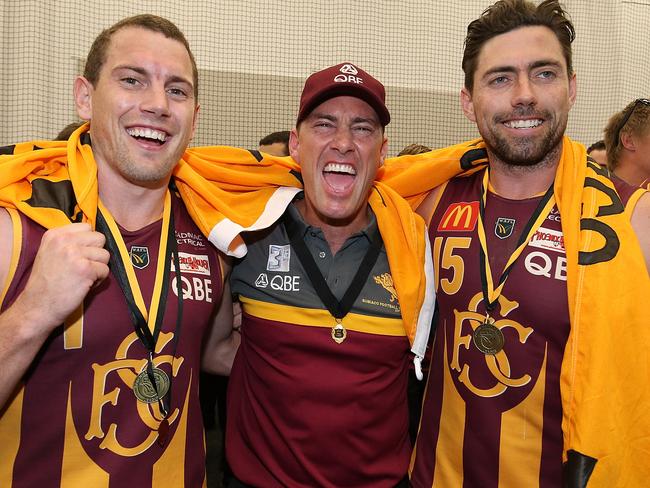 PERTH, AUSTRALIA - SEPTEMBER 23:  Jarrad Schofield, coach of Subiaco celebrates with Kyal Horsley and Chris Phelan after winning the WAFL Grand Final between Subiaco and West Perth at Optus Stadium on September 23, 2018 in Perth, Australia.  (Photo by Paul Kane/Getty Images)