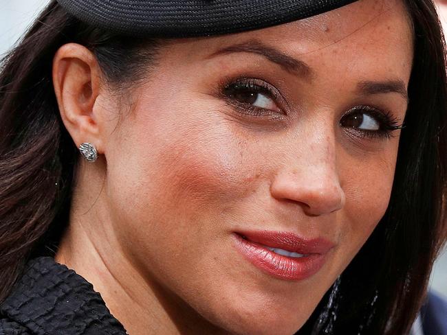 (FILES) In this file photo taken on April 25, 2018 Britain's Prince Harry (R) and his US fiancee Meghan Markle arrive to attend a service of commemoration and thanksgiving to mark Anzac Day in Westminster Abbey in London. Glamorous and elegant, Meghan Markle is set to freshen up the British royal family dress code, all while tailoring her outfits to suit her new role. Markle is 