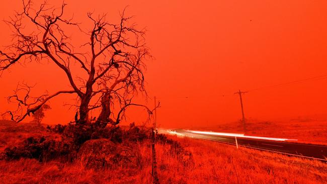 The sky turns red from smoke of the Snowy Valley bushfire on the outskirts of Cooma. Photo: AFP.