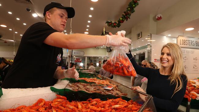 Gina Vuletich buys her Christmas prawns at De Costi seafood at the Fish Markets. Picture: Adam Taylor