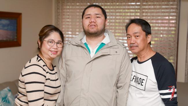 Kristian Diaz, centre, with parents Jocelyn and Geraldo. The family is grateful for the support they have received through the NDIS. Picture: Angelo Velardo