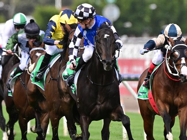 MELBOURNE, AUSTRALIA - OCTOBER 07: Mark Zahra riding Gold Trip looks over his shoulder before winning Race 8, the Tab Turnbull Stakes, during Melbourne Racing at Flemington Racecourse on October 07, 2023 in Melbourne, Australia. (Photo by Vince Caligiuri/Getty Images)