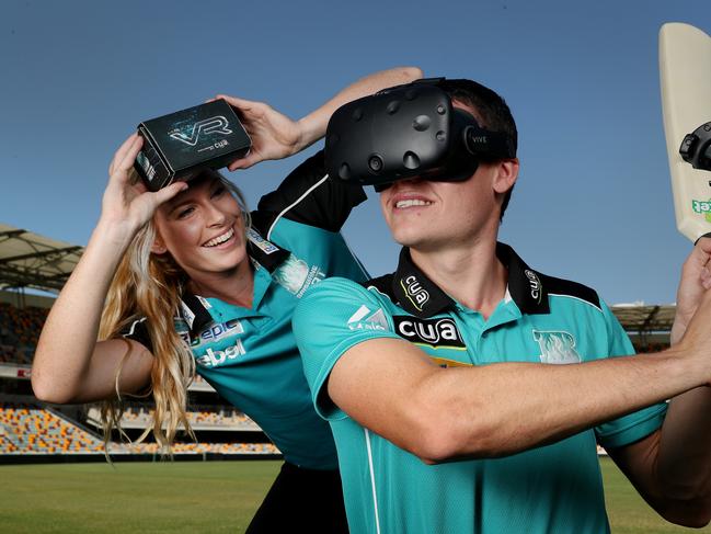 Brisbane Heat players Holly Ferling and Sam Heazlett with the new VR experience.  Pic Peter Wallis