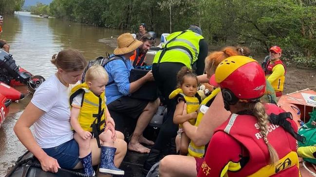 Penny Fenner and her two-year-old daughter Mahlia were rescued by surf life savers as rapidly rising flood water entered their Holloways Beach home as the Barron River flooded on Sunday. Picture" Supplied.