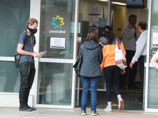 24/3/20: People queue at Centrelink at Marrickville. John Feder/The Australian.