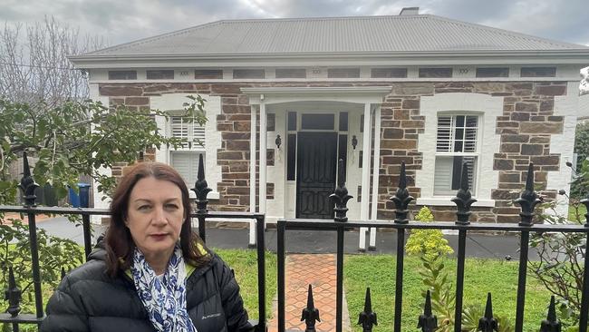 Catherine Miller outside her former home on Fisher Street. Pic: Emily Jarvis