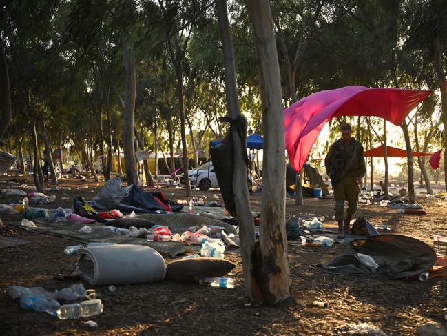 RE'IM, ISRAEL - OCTOBER 12: Israeli soldiers continue to search for ID and belongings among the cars and tents at the Supernova Music Festival site on October 12, 2023 in Kibbutz Re'im , Israel. Israel has sealed off Gaza and launched sustained retaliatory air strikes, which have killed at least 1,200 people with more than 300, 000 displaced, after a large-scale attack by Hamas. On October 7, the Palestinian militant group Hamas launched a surprise attack on Israel from Gaza by land, sea, and air, killing over 1,200 people and wounding around 2800. Israeli soldiers and civilians have also been taken hostage by Hamas and moved into Gaza. The attack prompted a declaration of war by Israeli Prime Minister Benjamin Netanyahu and the announcement of an emergency wartime government. (Photo by Leon Neal/Getty Images) *** BESTPIX ***