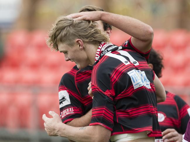 Mitchel Clem is congratulated after his try for Valleys. Picture: Kevin Farmer.