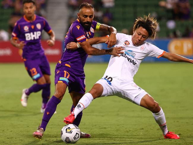 PERTH, AUSTRALIA - FEBRUARY 26: Diego Castro of the Glory and Riku Danzaki of the Roar contest for the ball during the A-League match between the Perth Glory and the Brisbane Roar at HBF Park, on February 26, 2021, in Perth, Australia. (Photo by Paul Kane/Getty Images)