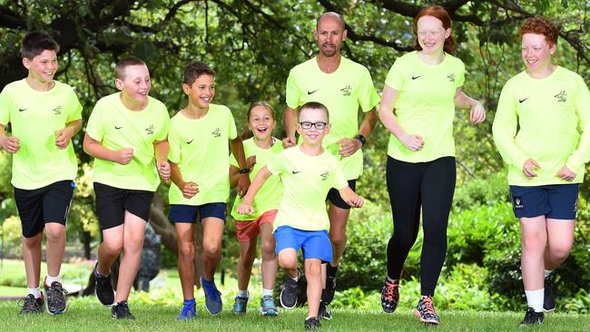 Herald Sun CityLink Run for the Kids race director Steve Moneghetti (centre) with kids Liam, 11, Ben, 10, Liam, 11, Abbie, 8, Finn, 5, Keeley, 16 and Matt, 14. Picture: Josie Hayden.