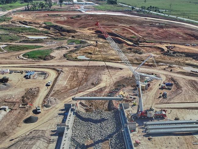 An aerial view of the work taking place at the site of the Western Sydney Airport. A bridge the size of the Sydney Harbour Bridge is being built.