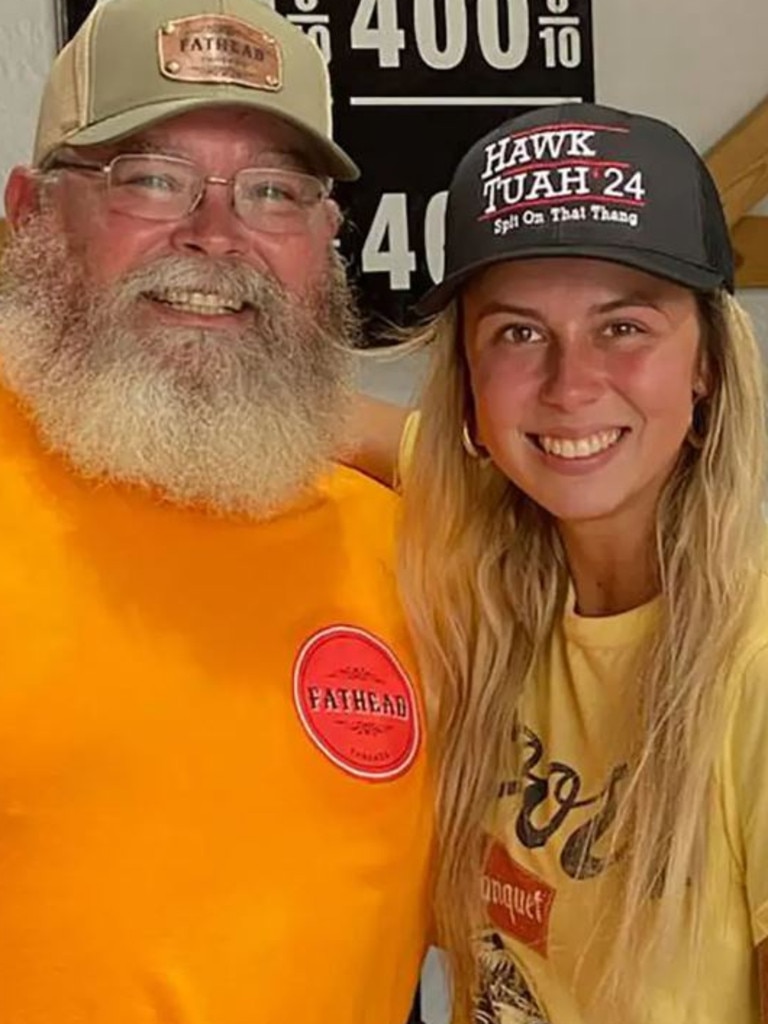 Welch poses in one of her official Hawk Tuah Girl hats with Fathead merch founder Jason Poteete. Picture: Fathead Threads