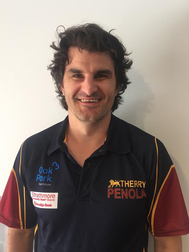 Damien Peverill shows off his new colours after signing as Therry Penola coach.