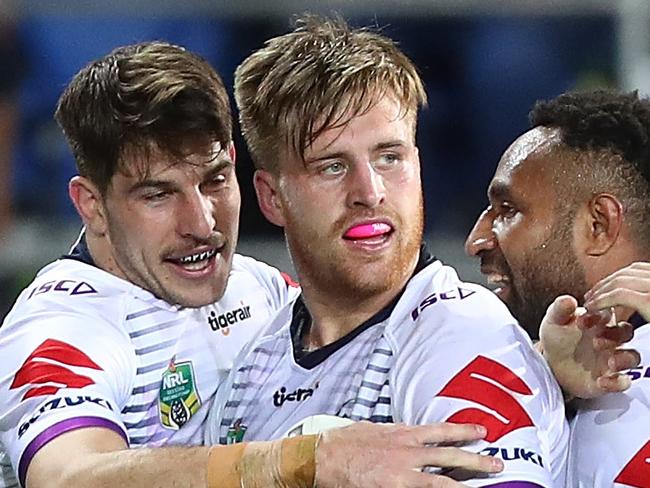 GOLD COAST, AUSTRALIA - AUGUST 25:  Cameron Munster of the Storm celebrates a try during the round 24 NRL match between the Gold Coast Titans and the Melbourne Storm at Cbus Super Stadium on August 25, 2018 in Gold Coast, Australia.  (Photo by Chris Hyde/Getty Images)