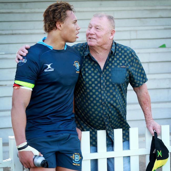 Dennis Waight Jr with his dad. Picture: AAP