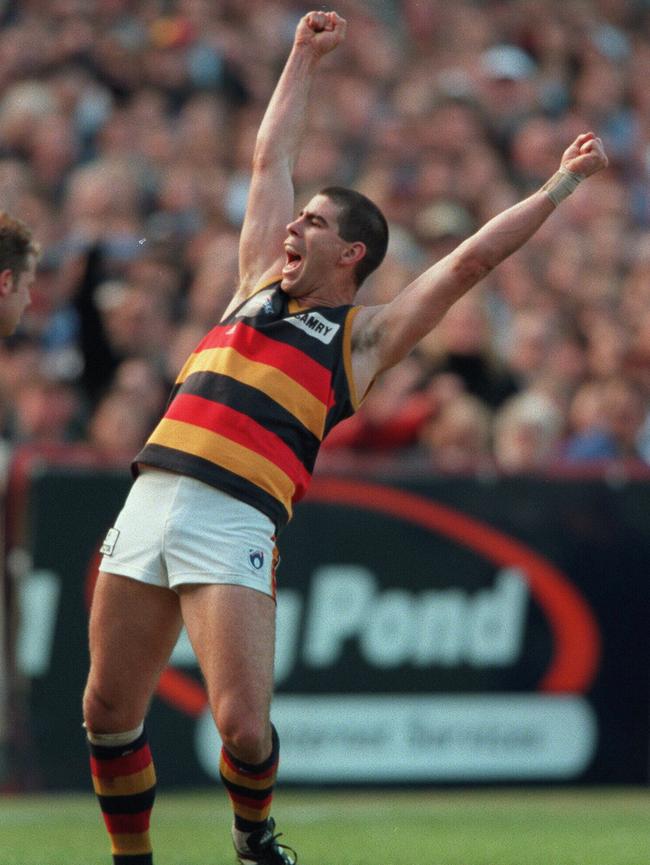 Premiership hero Darren Jarman celebrates beating North Melbourne in the 1998 AFL Grand Final.