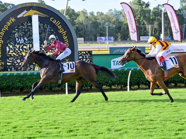 Jake Bayliss winning the $1m The Archer slot race in Rockhampton on the Matt Dunn-trained gelding Lubrication ahead of Comrade Rosa on Sunday, May 4, 2025. Picture: Matthew Harris / Caught in the Act Photography