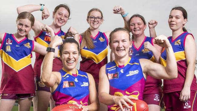 Lions AFLW players Ally Anderson and Shannon Campbell with Moreton Bay Lions juniors Jaydah Barrie 13, Chaye Barrie 15, Kirra Barrie 16, Katie Rooks 17, and Bailey Rooks 17 at the Moreton Bay Sports Complex at Burpengary where Brisbane will take on Essendon this weekend. Picture Lachie Millard