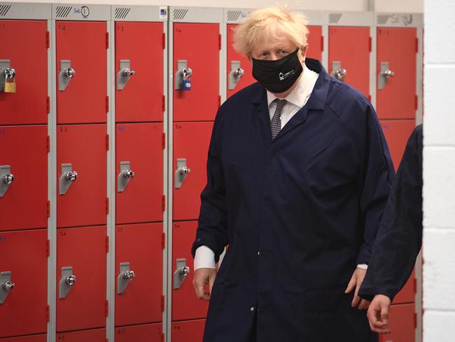 DEWSBURY, ENGLAND - JUNE 18: Britain's Prime Minister Boris Johnson enters the Automotive shop during a visit to Kirklees College Springfield Sixth Form Centre on June 18, 2021 in Dewsbury, United Kingdom. (Photo by Oli Scarff - WPA Pool / Getty Images)