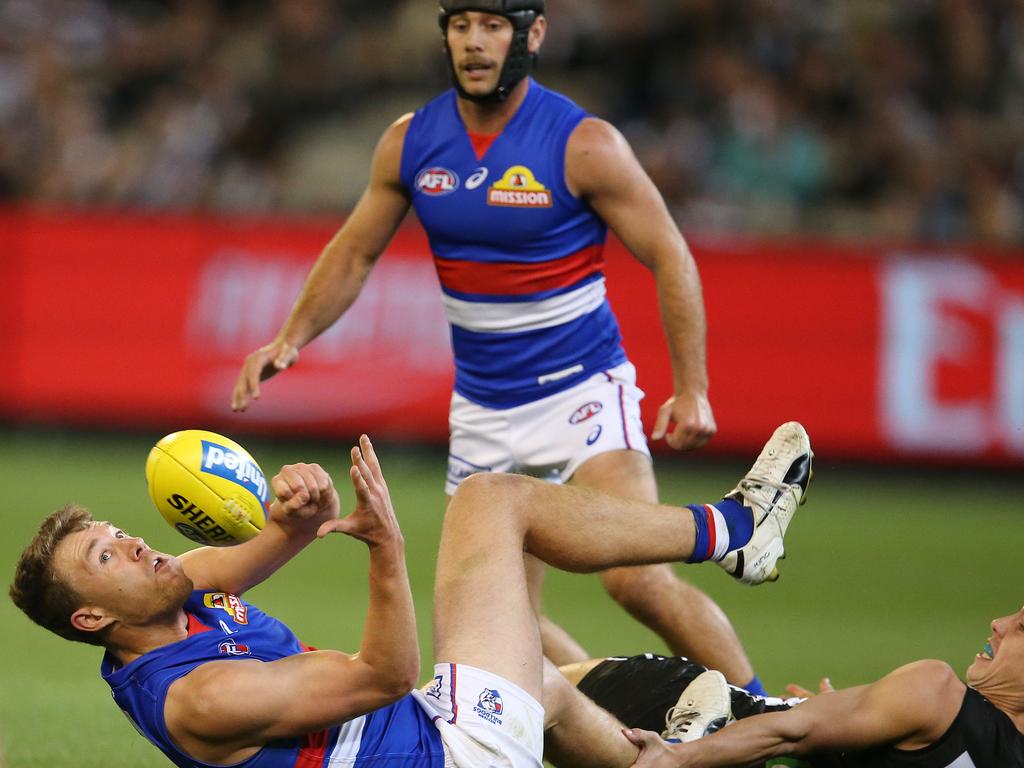 Bulldogs premiership players Jack Macrae (bottom) and Caleb Daniel have worked hard to win their spots back ahead of Friday night’s elimination final. Picture: Michael Klein