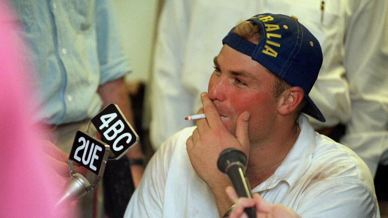 Shane Warne has a cigarette during an interview.