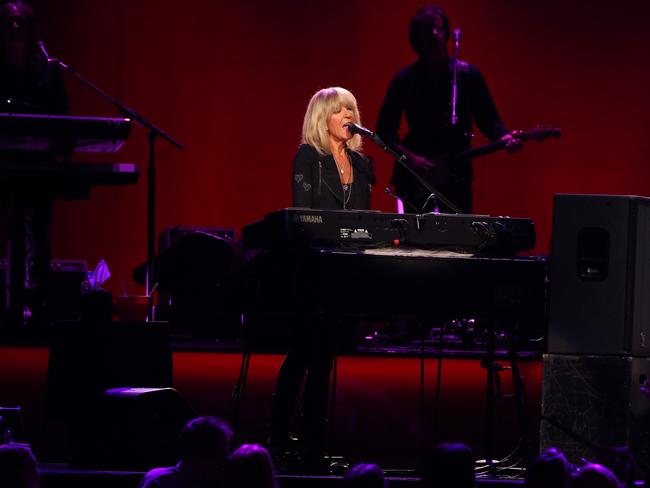 Fleetwood Mac performing in Sydney, Lindsey Buckingham - lead guitar, rhythm guitar, vocals, Stevie Nicks - vocals, tambourine, Christine McVie - vocals, keyboards, maracas, accordion on 