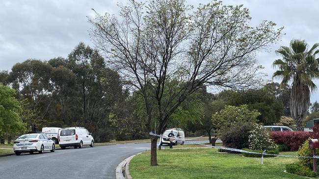 Two homes have been taped off on Thursday morning with police vehicles parked in the street as officers investigate. Picture: Kate Kiernan