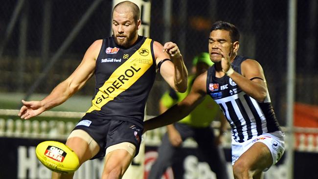 Glenelg’s Aaron Joseph under pressure from Port’s Jake Neade.