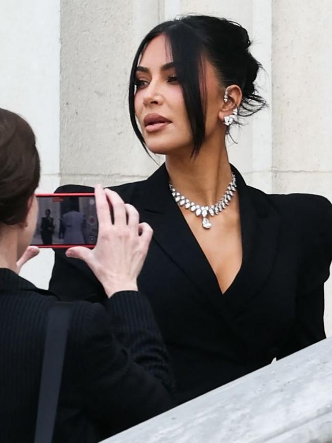 She wore a massive diamond necklace and matching earrings. Picture: Thomas SAMSON / AFP