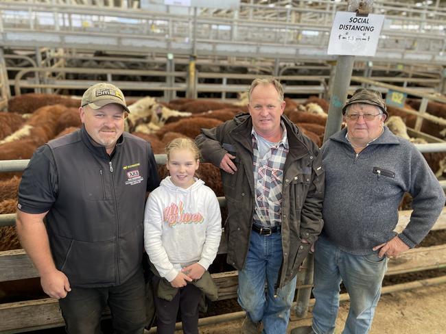 Daniel Rikken and daughter Siena bought 33 Hereford steers at 321kg for $1720 or 536c/kg from vendors  Bryan Whelan and friend Frank Balcombe at the Leongatha store sale.