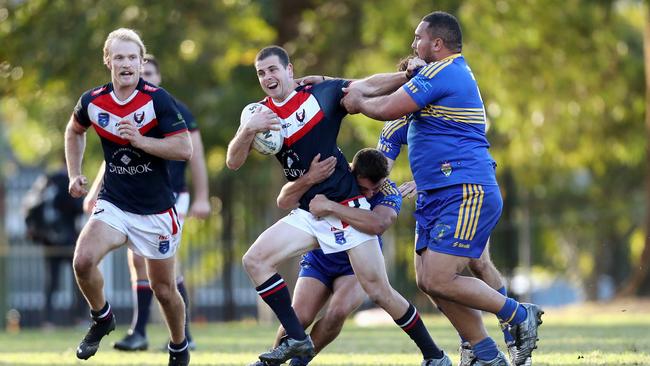 Erina’s Toby Elliot taking a run. Picture: Sue Graham