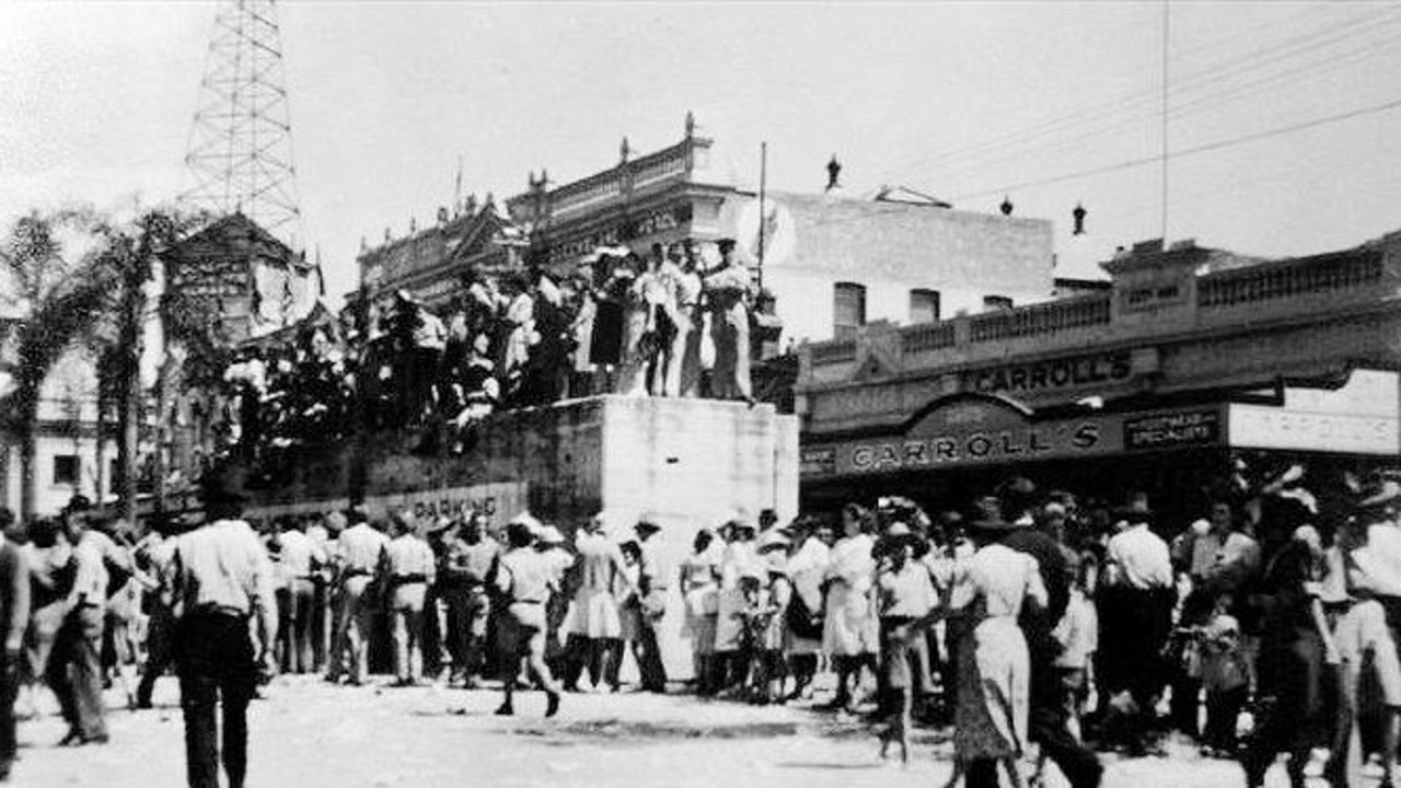 PRIME TIME: Townsville crowds celebrating Victory in the Pacific on 25 August 1945. (Note the concrete air raid shelter in Flinders Street.)