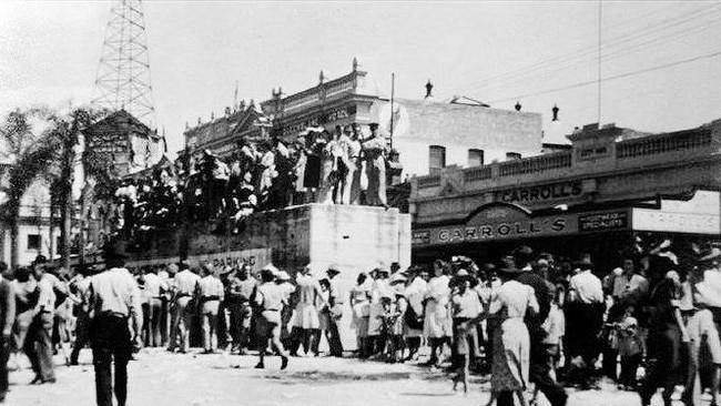 PRIME TIME: Townsville crowds celebrating Victory in the Pacific on 25 August 1945. (Note the concrete air raid shelter in Flinders Street.)