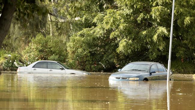 Cars submerged on Willow Drive, Paradise, after the flooding. Picture: Bianca De Marchi