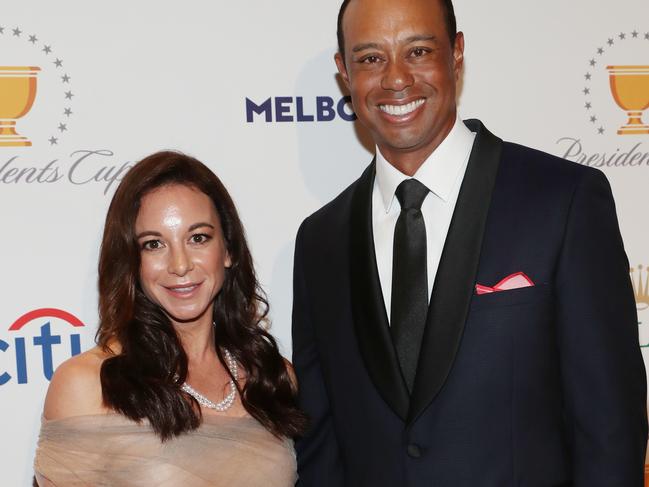 USA team captain Tiger Woods and partner Erica Herman arrive at the Presidents Cup Golf gala at Crown in Melbourne. Tuesday, December 10. 2019. (AAP Image/David Crosling) NO ARCHIVING