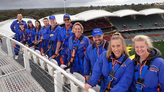 Nova's 'Ashventures' winners Candice Blasl and husband Troy Henderson on the roof of Adelaide Oval with the Nova 106.9 team. Picture: Nova