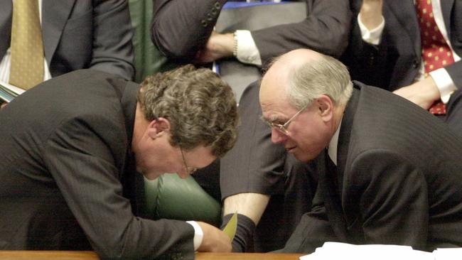 The-then foreign affairs minister Alexander Downer (left) with Prime Minister John Howard during Question Time in federal parliament in August, 2002.