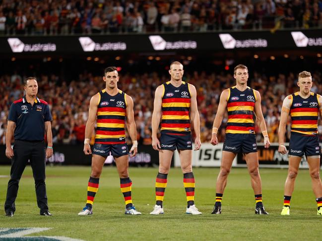 ADELAIDE, AUSTRALIA - SEPTEMBER 22: Crows players line up for the national anthem during the 2017 AFL First Preliminary Final match between the Adelaide Crows and the Geelong Cats at Adelaide Oval on September 22, 2017 in Adelaide, Australia. (Photo by Michael Willson/AFL Media/Getty Images)