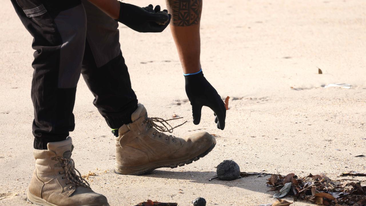 Council workers were called in to clean up the mysterious black balls that washed up on Coogee Beach and other Sydney beaches in mid-October. Picture: NewsWire / Damian Shaw