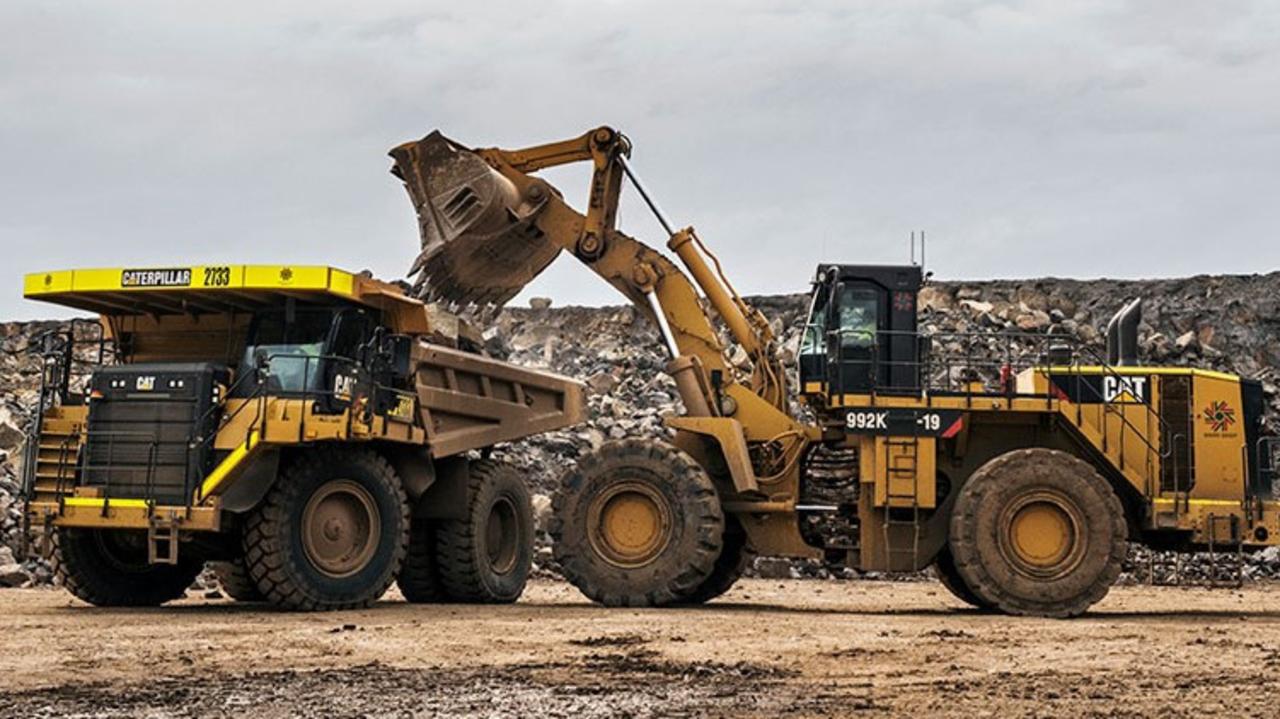 Large trucks instead of a low-impact conveyor belt move the material from one part of the site to another before the material is processed and then put into road trucks to be transported via Mount Cotton Rd. Picture: Barro Group