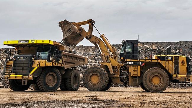 Large trucks instead of a low-impact conveyor belt move the material from one part of the site to another before the material is processed and then put into road trucks to be transported via Mount Cotton Rd. Picture: Barro Group